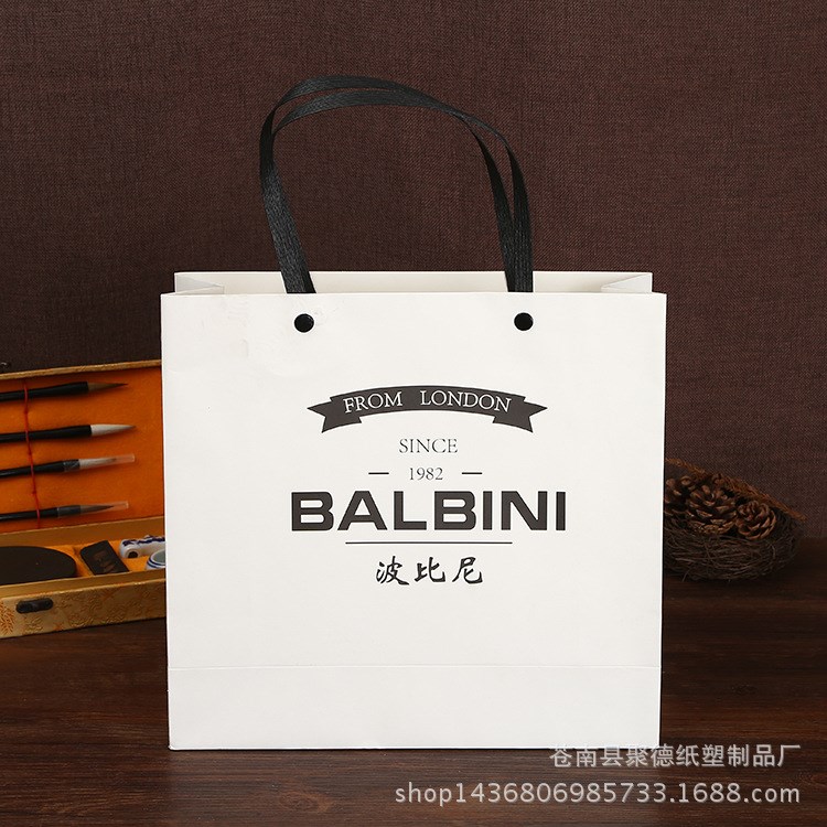 廠家直銷環(huán)保精美服裝購物包裝袋 印logo白卡紙手提紙袋
