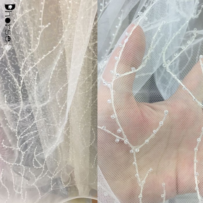 2018新款釘珠子網(wǎng)布刺繡滿幅連衣裙女士裙子刺繡面料花邊出售