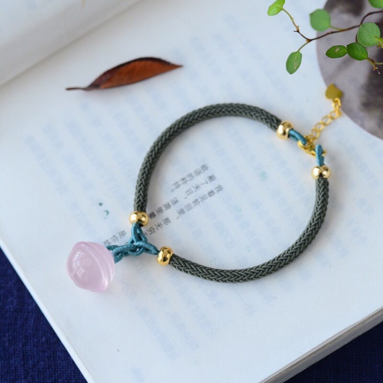 廠家直銷 清新脫俗天然星光粉晶轉(zhuǎn)鈴鐺手鏈 手工編織清新可人