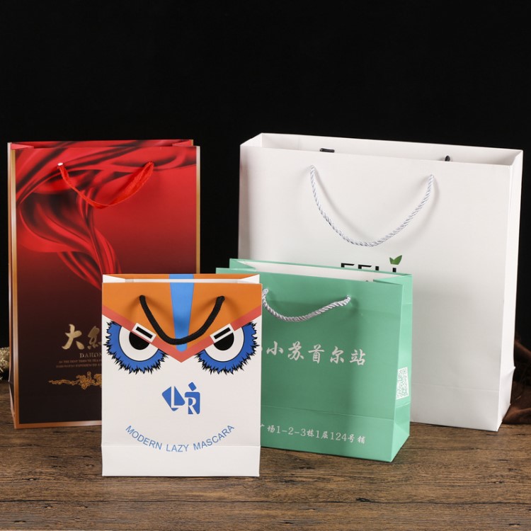 彩印服裝購(gòu)物紙袋定做創(chuàng)意手提禮品袋定制環(huán)保白卡紙包裝袋印logo