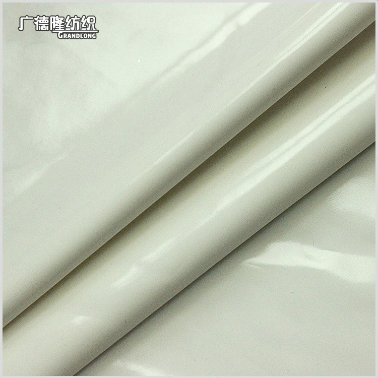 春秋廣德隆紡織柔軟微彈亮面光澤漆皮PU面料箱包半裙小腿褲外套布