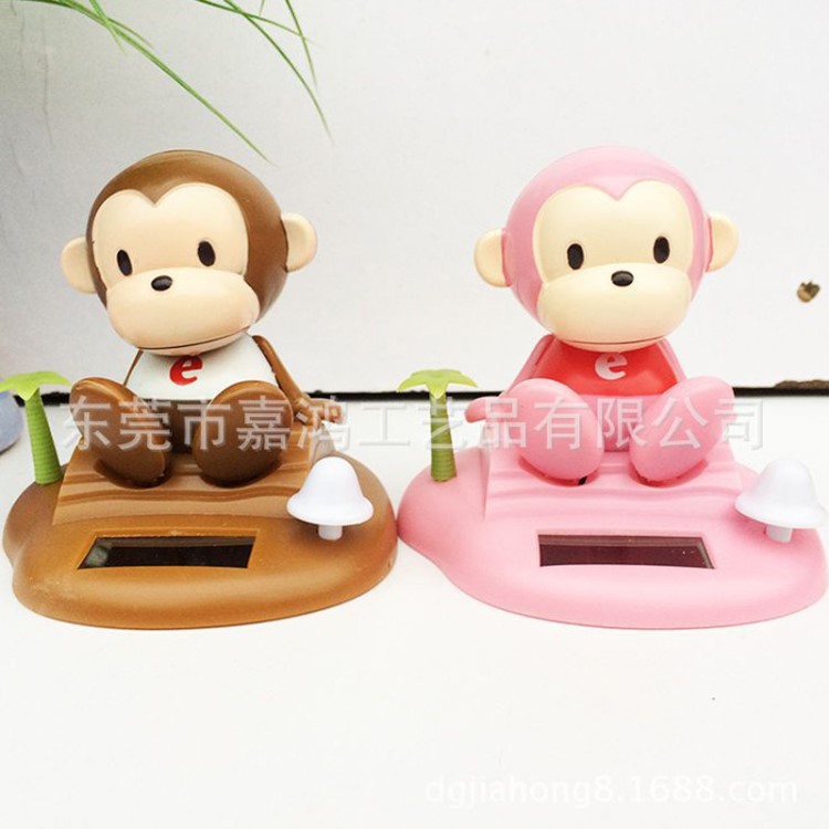 訂做企業(yè)吉祥物太陽能轉(zhuǎn)經(jīng)輪汽車擺件 abs塑料動(dòng)漫搖擺公仔